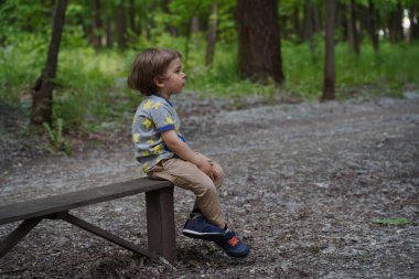 Elementary school boy looking up at the sky. Selective focus
