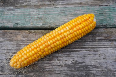 Fresh corn on wooden table, Top view close-up