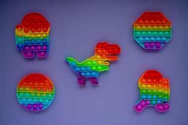 pop it collection, toys for kids. Very Peri background. Flat lay, copy space