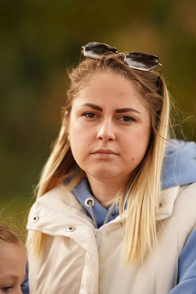 stock image A sad young mother preoccupied with life's problems, a portrait of an unhappy blonde in the park.