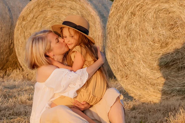 Mom Kisses Her Beloved Daughter While Sitting Field Haystack Loving — Stock Photo, Image
