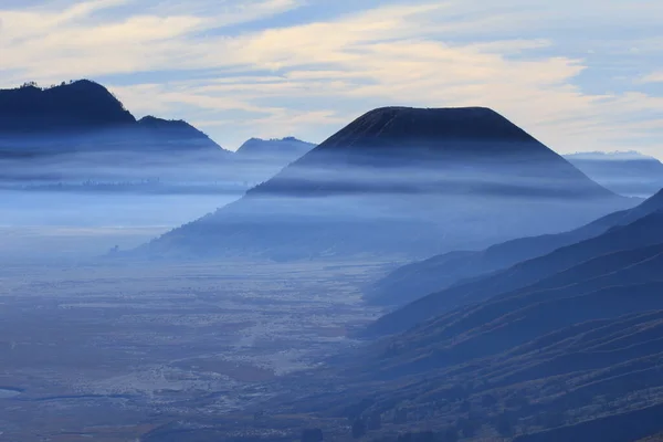 Foggy mountain background of Bromo Tengger Semeru National Park, Indonesia