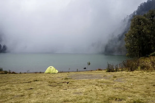 A tent with misty lake on background at Ranu Kumbolo, Mt Semeru, Indonesia