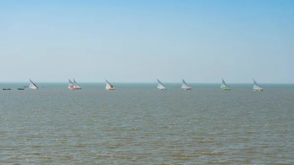 Sea and Blue Sky Background with traditional sailboat in Indonesia