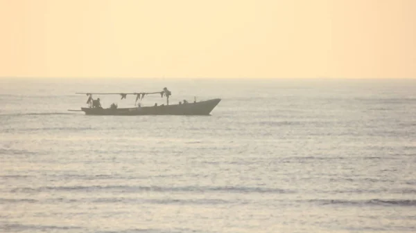 Stock image Blurred sunrise backgrounds with boat against the sunshine