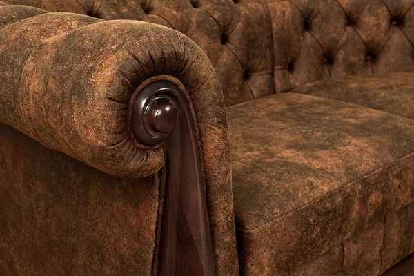 Close-up of a premium leather sofa with natural wood inserts. Selective focus.