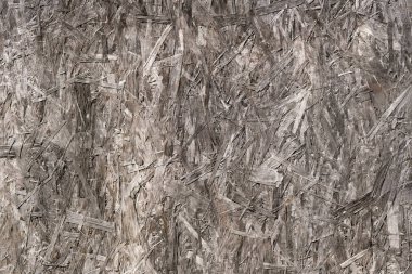 Sıkıştırılmış talaştan yapılmış ahşap bir yaprağın yakın çekim dokusu. Gri. Tasarım boş.