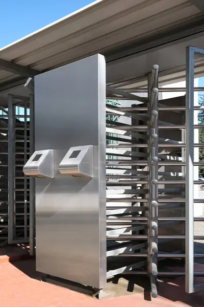 Vertical images turnstile for the passage of fans to the stadium using an electronic fan card. Modern security technologies.