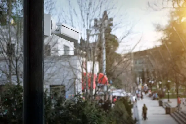 Close-up of a security camera in a public park. Control of offenses in public places.
