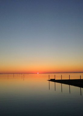 splendid sunset over the Arcachon basin in the New Aquitaine region in south-west France                     