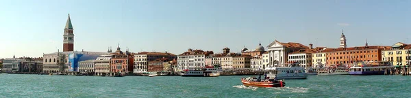 Panoramic view from the lagoon of Venice known as the most serene on the Adriatic Sea. Venice\'s canals are lined with Gothic and Renaissance palaces and the city is home to St. Mark\'s Basilica and its Byzantine mosaics, and St. Mark\'s Campanile