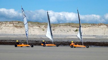 land yachts on a windy beach in France on the North Sea coast