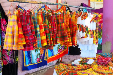 stand selling dresses made of madras on a market in Martinique. French West Indies. - FWI