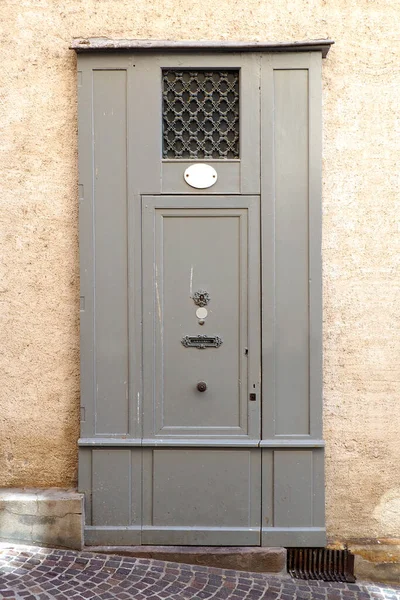 Old solid wood door of a house of Albi, large and old French town on the banks of the Tarn, in the Tarn department in the Occitan region