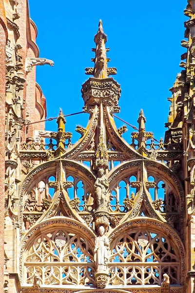 canopy of the portal of the superb Sainte Cecile cathedral built in red brick in the river Tarn in Albi in Occitania (South of France) - Free entrance
