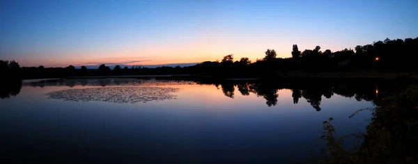 stock image wonderful Sunset on the small lake of the charming village of Perche, Thiron-Gardais, in which the television host Mr. Stephane Bern has settled