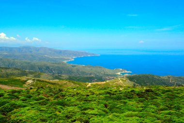  View of the west coast of Andros, famous Cycladic island, in the heart of the Aegean Sea, near Gavrio bay  clipart