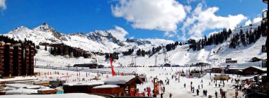 Panoramic view of the center of the famous La Plagne-Bellecote ski resort in the heart of the French Alps in the Tarentaise valley  at the foot of Mont Blanc clipart