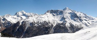 Panoramic view of the ski slopes of the famous La Plagne-Bellecote ski resort in the heart of the French Alps in the Tarentaise valley at the foot of Mont Blanc clipart