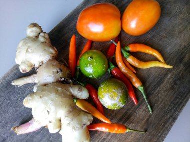 Condiments on a wooden cutting board