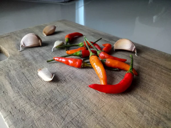 Condiments on a wooden cutting board
