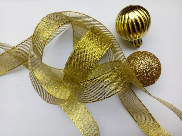 Shiny golden ornament on a white background