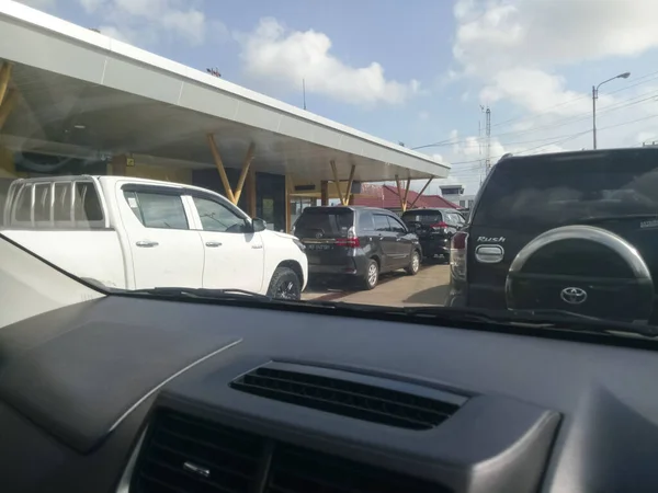 Cars queue in front of an airport