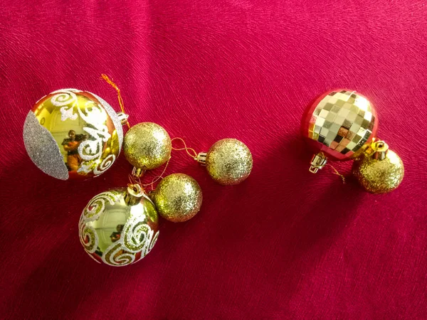 Shiny Christmas baubles isolated on textured background