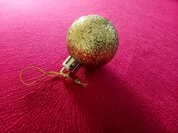 Shiny Christmas baubles isolated on textured background