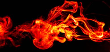 Red smoke. Beautiful fiery abstraction, on a black isolated background. Close-up. Saturated and colorful photo for screensaver on your desktop.