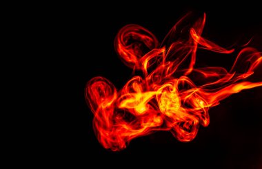 Red smoke. Beautiful fiery abstraction, on a black isolated background. Close-up. Saturated and colorful photo for screensaver on your desktop.