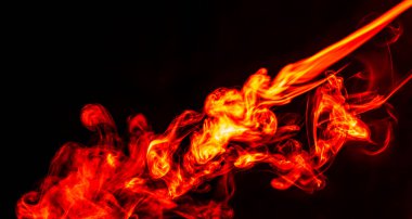 Red smoke. Beautiful fiery abstraction, on a black isolated background. Close-up. Saturated and colorful photo for screensaver on your desktop.