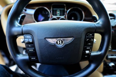 Chisinau, Moldova - April 8, 2021: Bentley Continental GT Coupe sports car. Editorial photo. Interior view of the salon. Yellow leather interior.