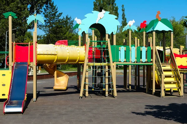 Stock image Children's wooden playground safe recreation area at public park