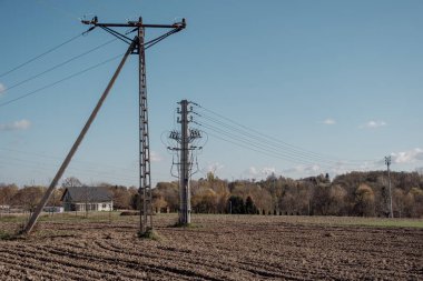 Energy infrastructure against the background of buildings, forest and sky