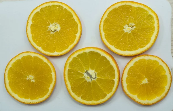 Sliced oranges for drying on paper