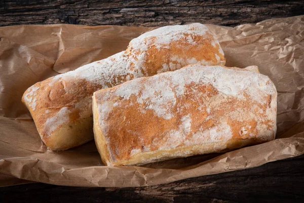 stock image Fresh homemade rustic sourdough bread on a rustic wood background.