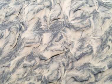 Dalgalı ıslak kum dokusu. Doğal arkaplan.