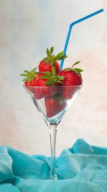 some strawberries in a glass with a straw to taste them clipart