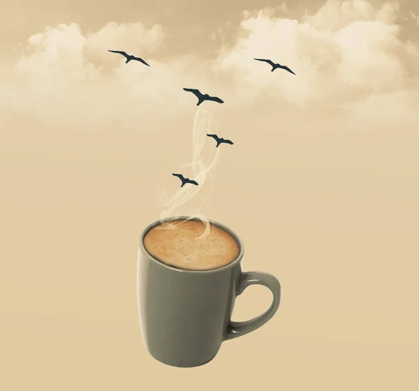 Coffee cup with steam, clouds and birds