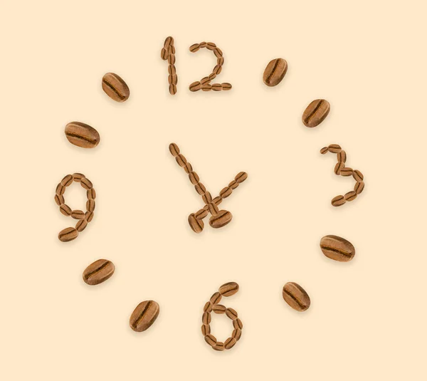 Clock made of coffee beans. coffee time concept
