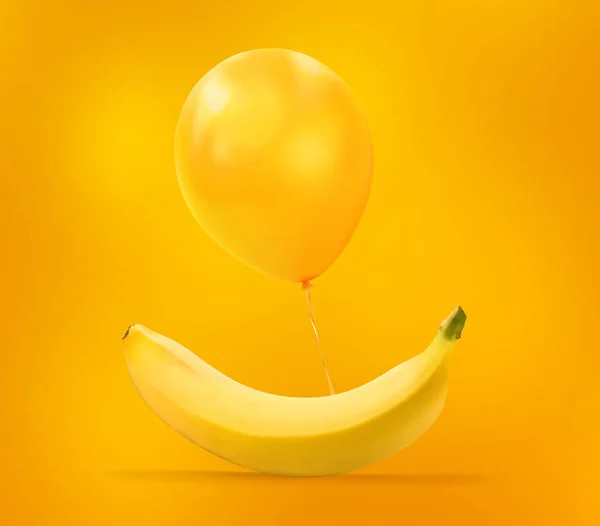 Palloncino Giallo Galleggiante Con Banana Sfondo Giallo Arancione Idea Concetto — Foto Stock