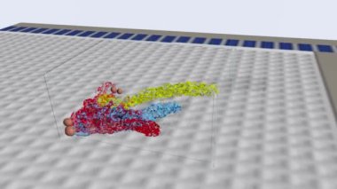 Three different fluids are mixing together and moving some nuts in a transparent box.