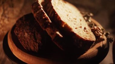Fresh Sliced Black Rye Bread on A Tray, Close up. Slices of Healthy Black Bread for Breakfast for Toast and Sandwiches. Healthy Vegan Food