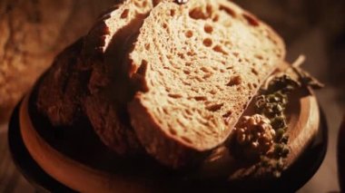 Fresh Sliced Black Rye Bread on A Tray, Close up. Slices of Healthy Black Bread for Breakfast for Toast and Sandwiches. Healthy Vegan Food
