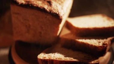 Fresh Sliced Black Rye Bread on A Tray, Close up. Slices of Healthy Black Bread for Breakfast for Toast and Sandwiches. Healthy Vegan Food