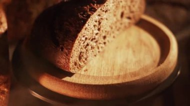 Fresh Sliced Black Rye Bread on A Tray, Close up. Slices of Healthy Black Bread for Breakfast for Toast and Sandwiches. Healthy Vegan Food