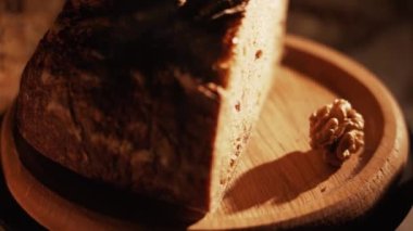 Fresh Sliced Black Rye Bread on A Tray, Close up. Slices of Healthy Black Bread for Breakfast for Toast and Sandwiches. Healthy Vegan Food