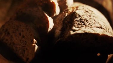 Fresh Sliced Black Rye Bread on A Tray, Close up. Slices of Healthy Black Bread for Breakfast for Toast and Sandwiches. Healthy Vegan Food