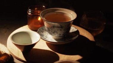 Brewing puerh tea. Traditional chinese tea ceremony. Tea pouring to teapot on a tea tray